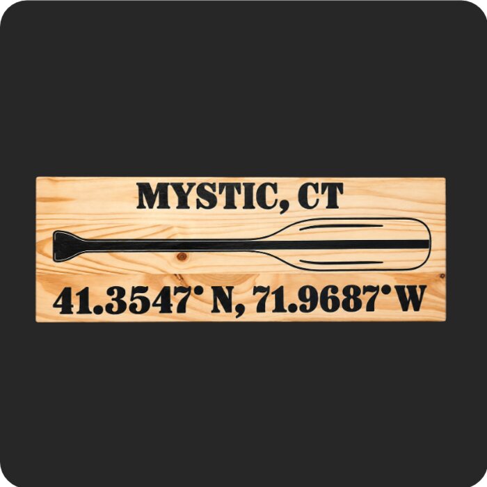 CNC carved wooden paddle sign with Mystic, CT coordinates